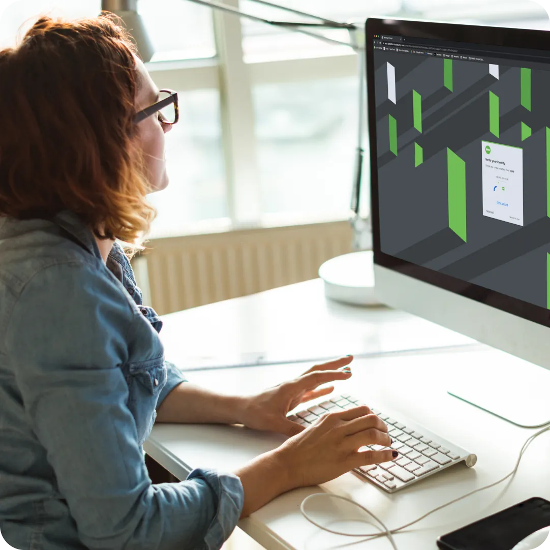 Professional looking at Duo on their desktop screen without the need for an entire IT team due to self-service security with Duo.