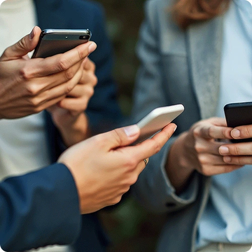 A close-up image of three people holding and using smartphones as trusted devices. The focus is on their hands and phones, emphasizing secure communication