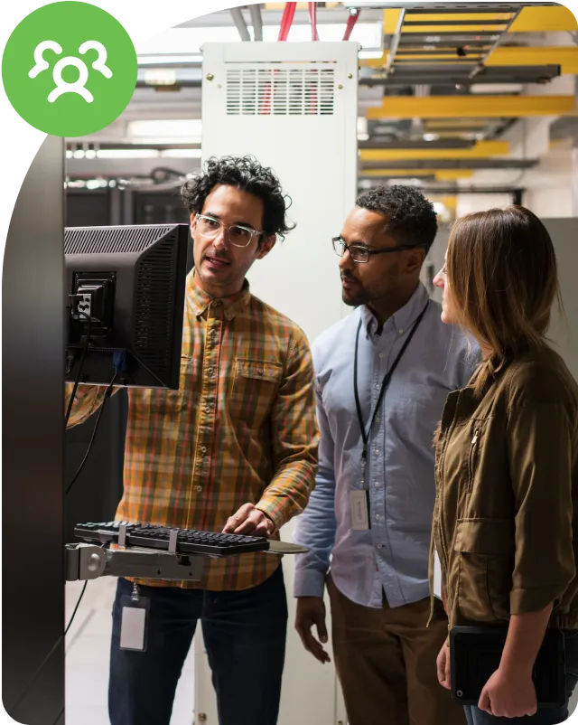 Three people looking at computer screen